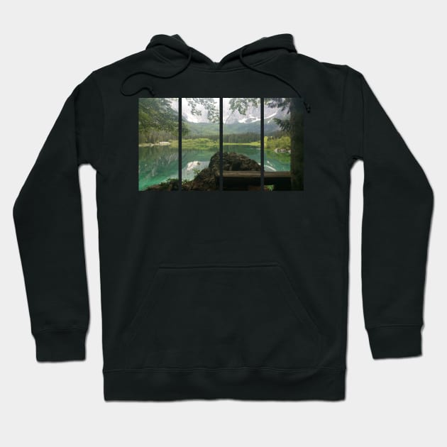 A static shot from the shore of Fusine lake in the Julian Alps with snowy mountains in background and a bench. Beautiful nature in a spring cloudy day; no people around. Italy Hoodie by fabbroni-art